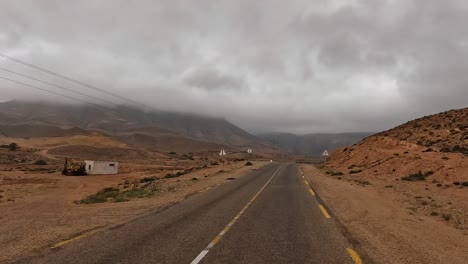 driving on mountain road of tunisia on cloudy rainy day, driver point of view