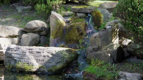 small water fall in the garden of korean temple during autumn in south korea