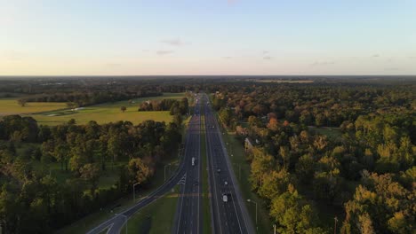 aerial footage of freeway interstate in georgia surrunded by forest and threes