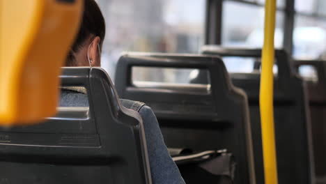public transportation during covid-19 virus outbreak, social distancing and face masks in tram