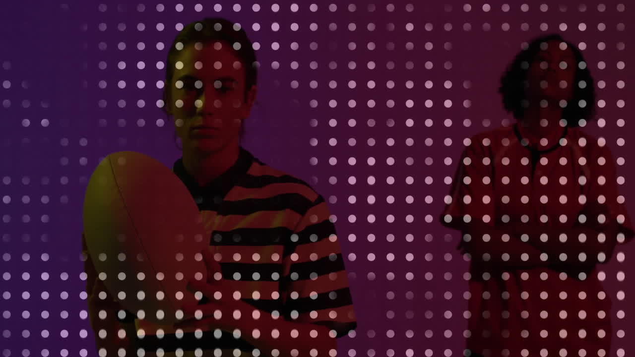 Female athlete and coach holding rugby ball against purple grid overlay, showing health data