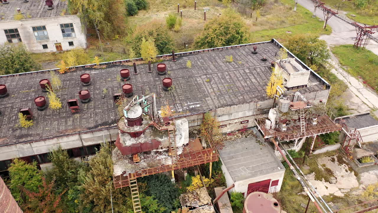 Old ruined empty industrial architecture. Abandoned destroyed factory territory.