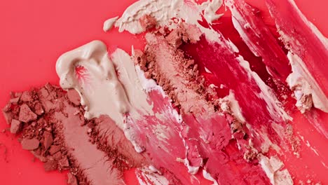 makeup swatches on a red background