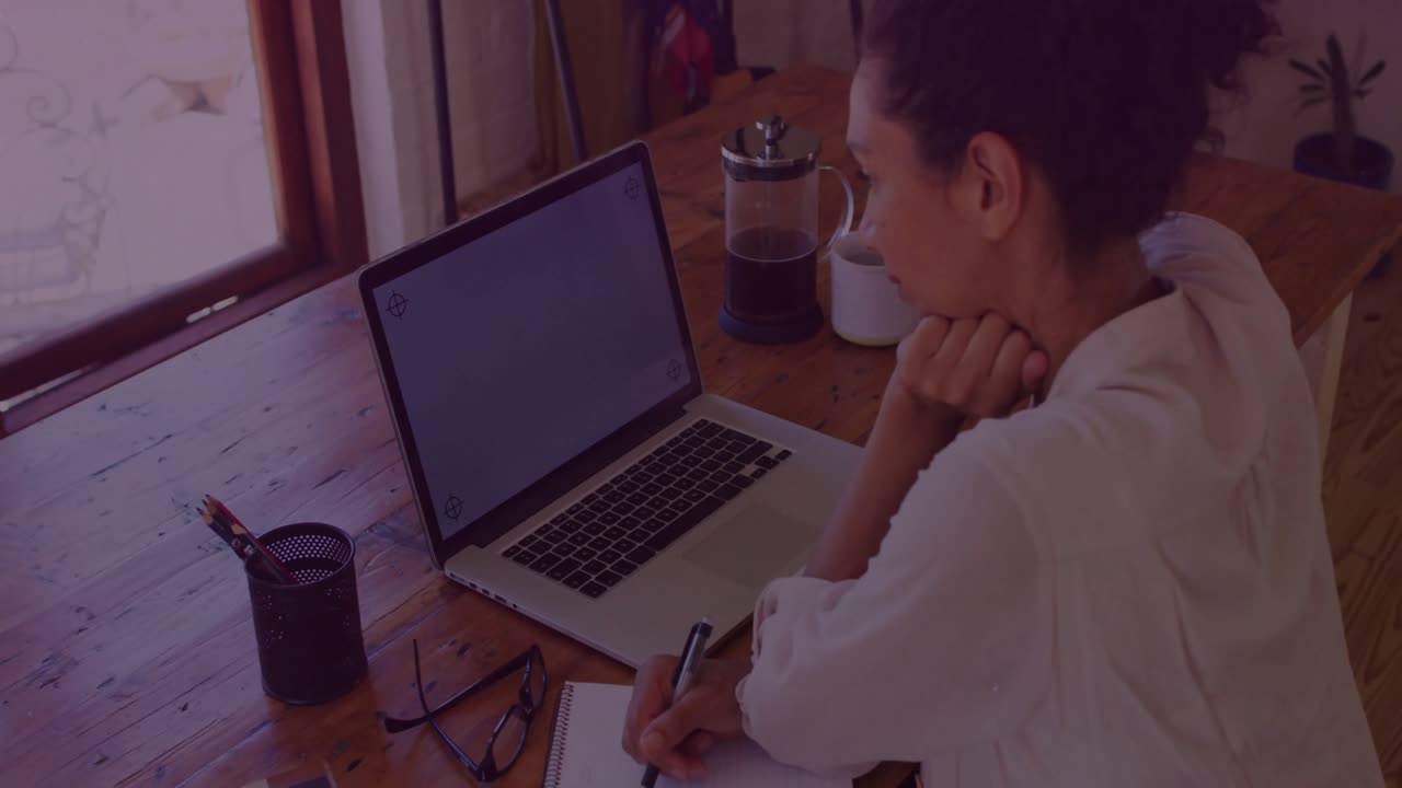 Woman opening notebook and starting note-taking while floating virus icons guiding health research