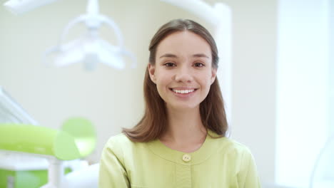 portrait of happy dentist in dental clinic. medical student in dentist office