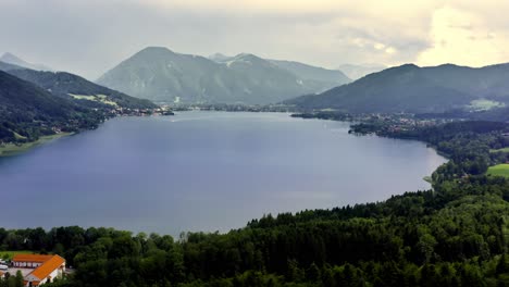 Wide-view-over-the-bavarian-Tegernsee-panning-right-to-reveal-the-beautiful-landscape-of-the-big-lake-in-southern-germany