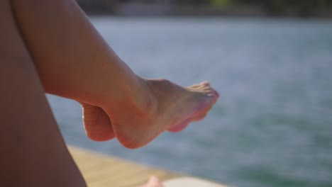 woman is exercising by the sea