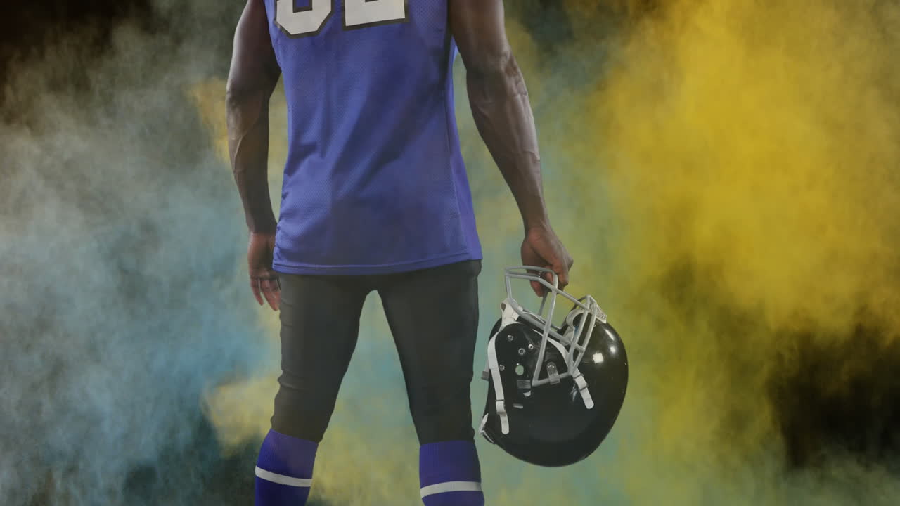 Animazione di polveri colorate su giocatore di football americano