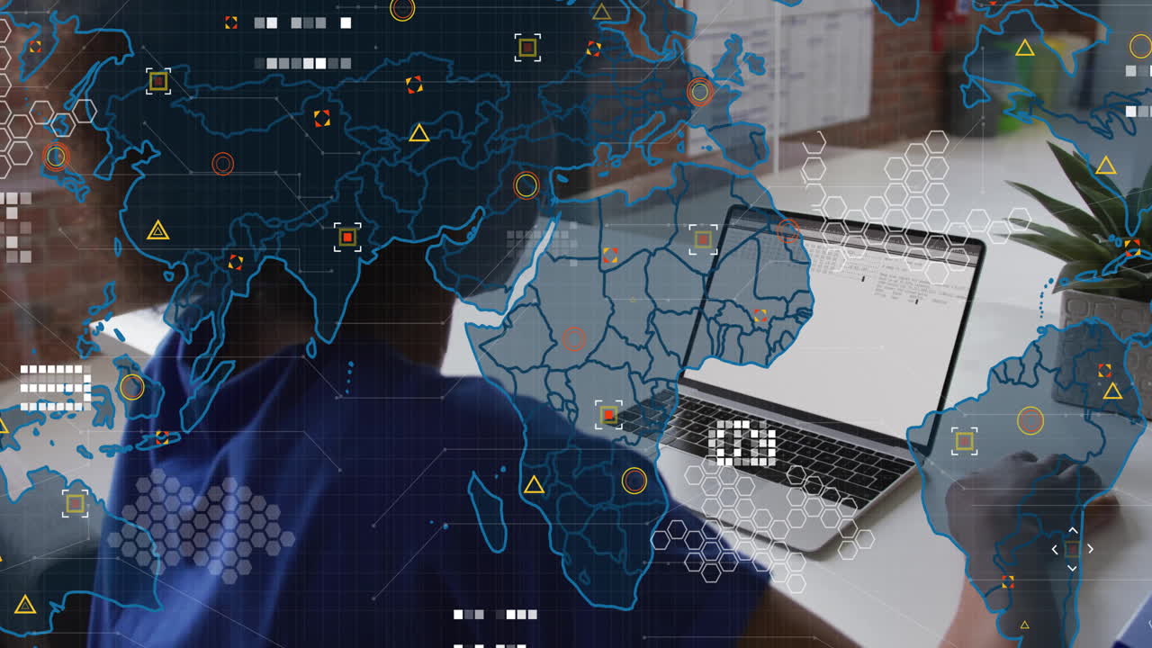 World map and data processing animation over person using laptop at desk