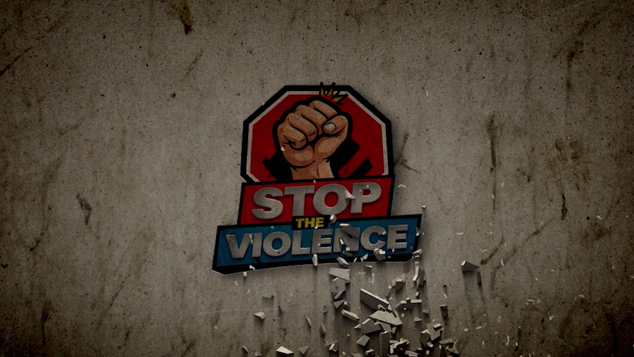 The 'Stop the Violence' logo crumbles dramatically against a textured wall, symbolizing conflict resolution.