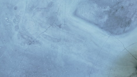 cracked icy surface texture with subtle lines and frosted crystal details