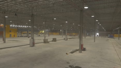 empty warehouse being constructed, huge, spacious hangar