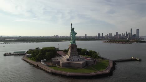 aerial view around the statue of liberty, in sunny new york, usa - orbit, drone shot