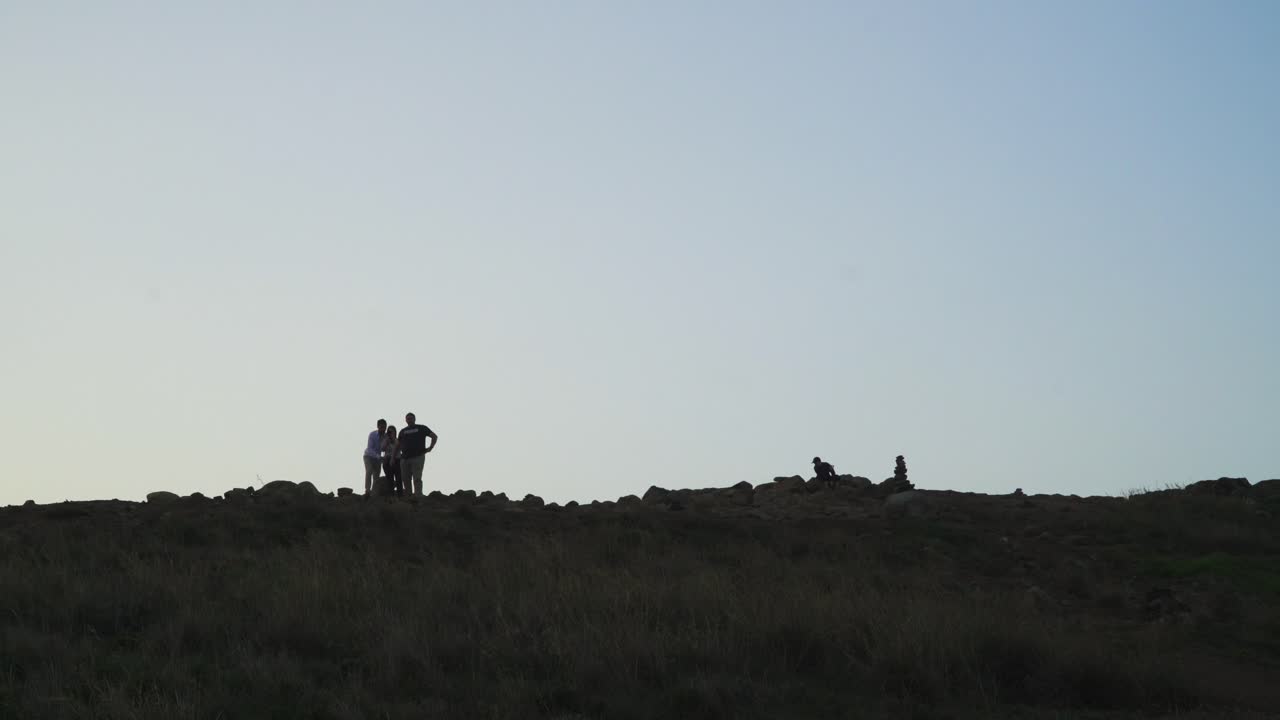 Some people silhouetes admiring and having some selfies in the sunset, Caniçal, Madeira Island, Portugal.