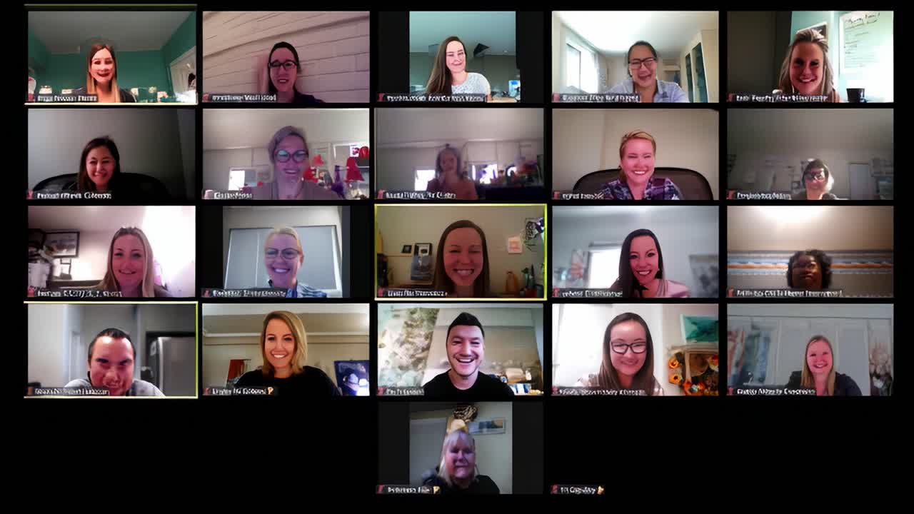 A Vibrant Virtual Gathering of Colleagues Sharing Laughter and Connections in a Zoom Meeting Filled with Smiles and Positive Energy Across Multiple Screens