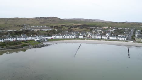 aerial sweep of port ellen mainstreet, islay