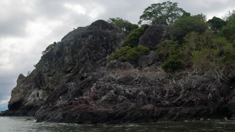 Private-Castaway-Island-Qalito-Malolo-Wilson-Tourism-Fiji-boat-ride-sailboat-Roro-Reef-coral-white-sandy-shores-rocky-boulder-hillside-tropical-palm-tree-paradise-Mamanuca-group-nature-landscape