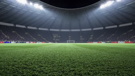 lush green football field awaits players as bright lights illuminate the empty stands of a large stadium, creating an atmosphere of anticipation before kickoff