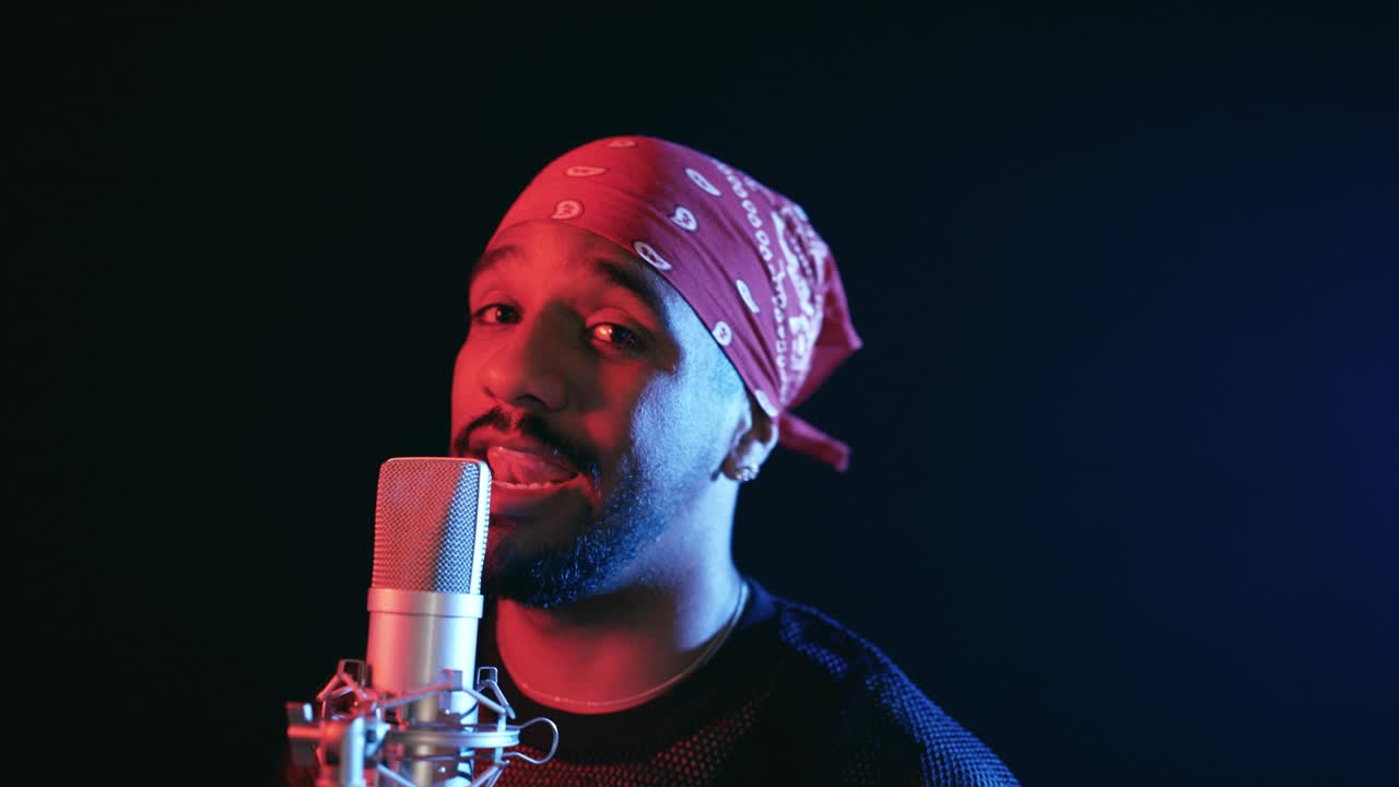 Reggaeton singer performing song in music studio
