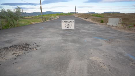 road closed leading to new housing construction in the mountains, tilt up reveal