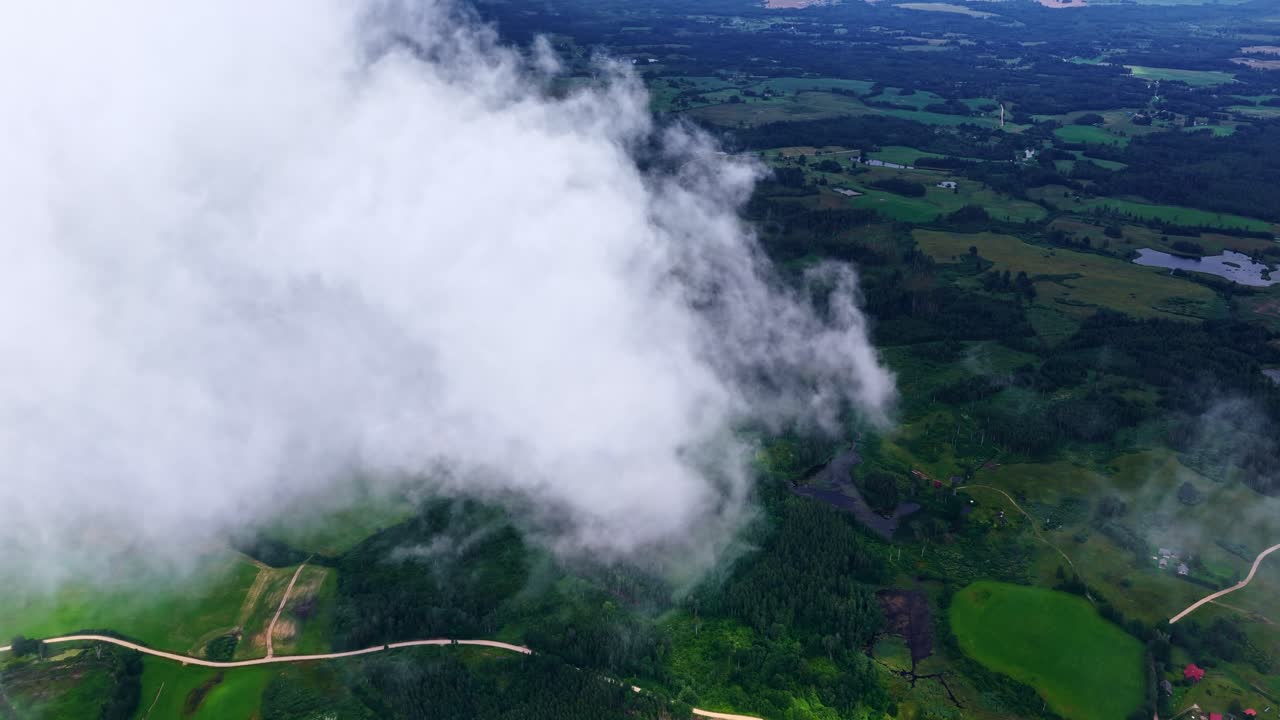 Above clouds high altitude aerial drone rural countryside farmland farm nature forest