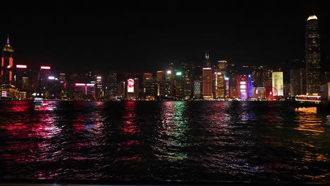 colorful skyline reflections on water at night