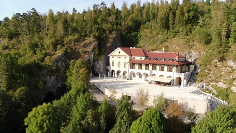 a drone shot of the postojna cave complex