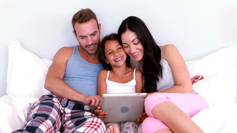 Happy-family-using-tablet