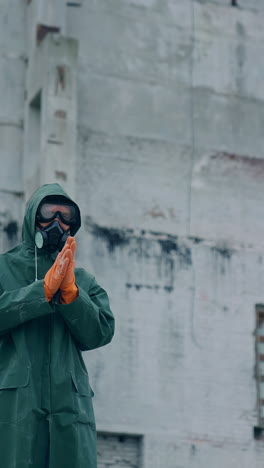 human in gas mask among ruins. man walking around in the post apocalyptic and ruined city