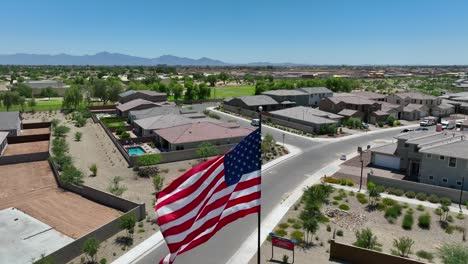 american flag waving in neighborhood in desert in southwest usa