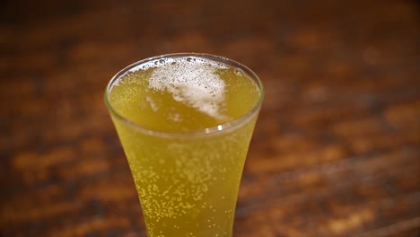 a glass of beer on a table