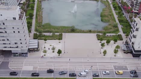 Aerial-view-of-wedding-procession-at-Jacques-Coeur-Basin-in-Montpellier