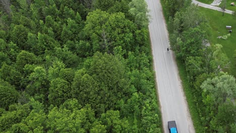 highway in rural landscape with a person running across