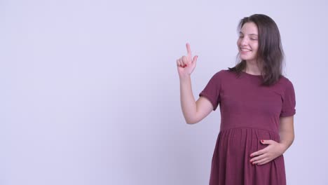 happy young beautiful pregnant woman