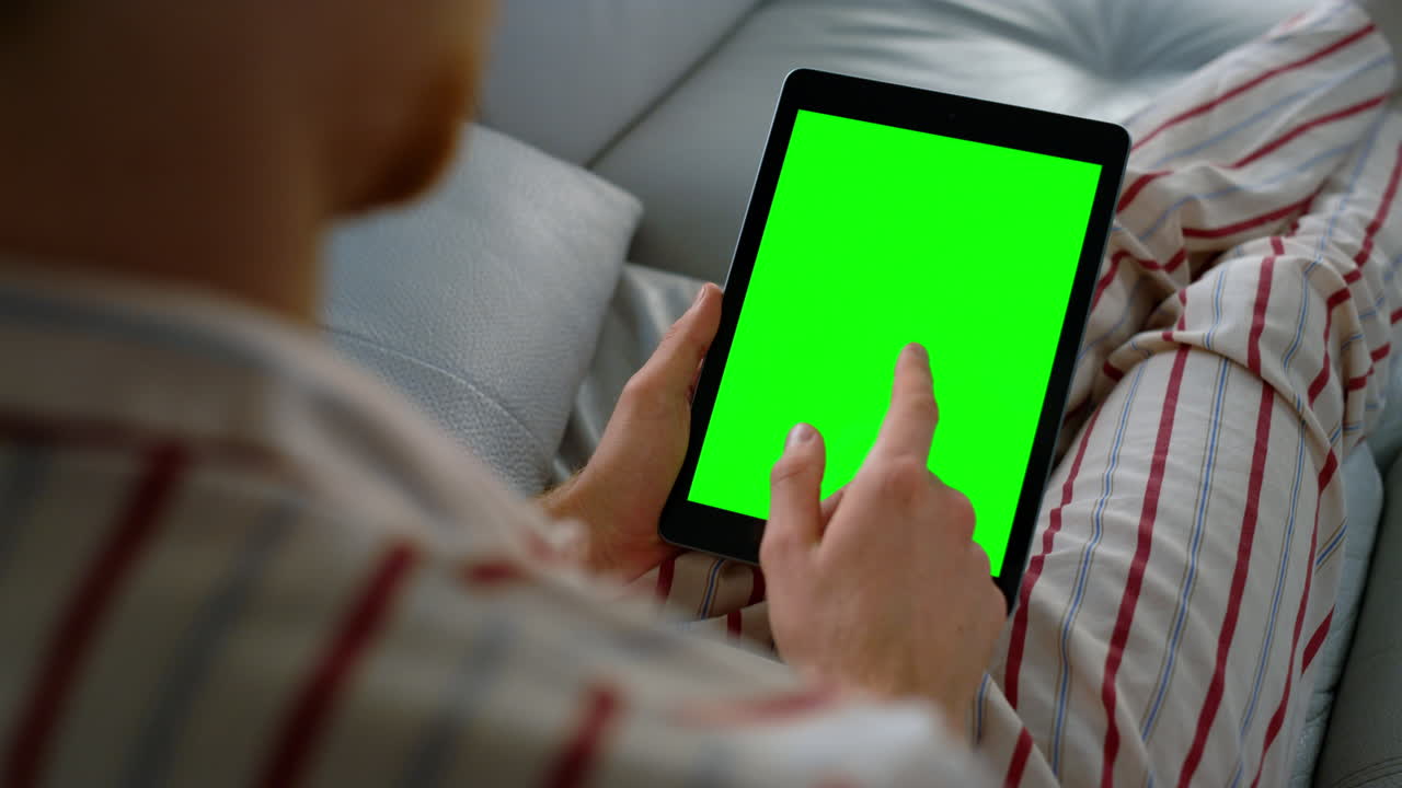 App user swiping chroma key tablet screen closeup. Manager checking mockup plan
