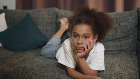 kid watching film at home