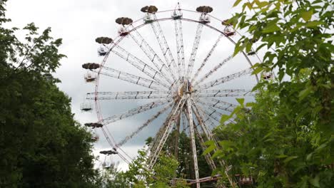 old abandoned ferris wheel in the nature