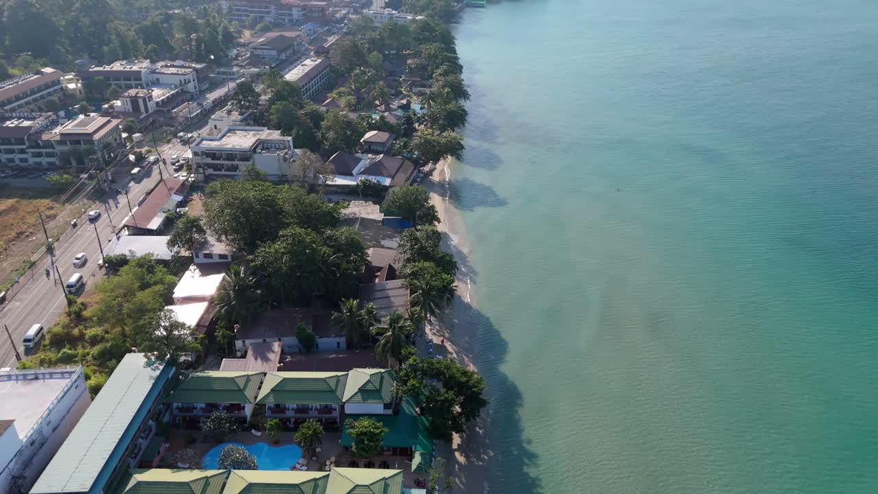 Aerial drone footage of White Sand Beach village, Koh Chang, Thailand. Capturing sunny morning views of the coast and tropical scenery