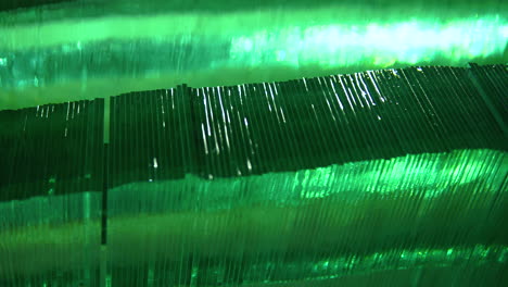 green cut plate sheet glass stacked in rows, shiny light reflections sideways