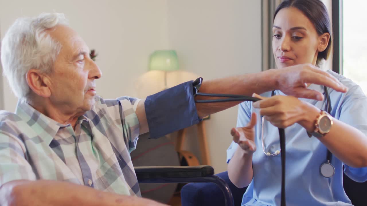 Animation of biracial female doctor checking pressure to caucasian senior man