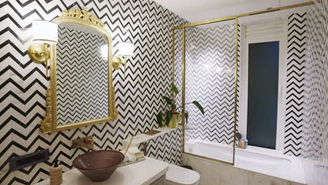 bathroom interior with black and white striped zigzag wall pattern