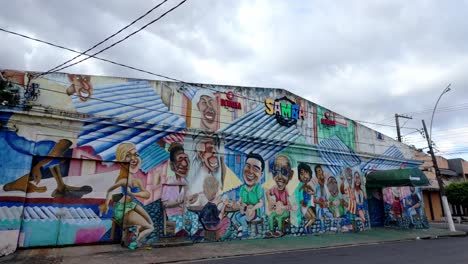 colorful samba mural on a building in a city street