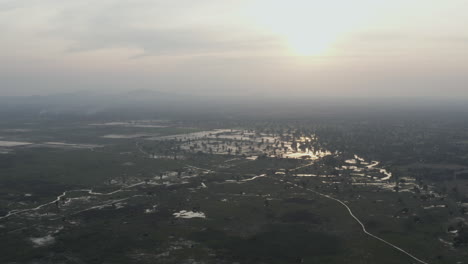 Fly-over-Rice-fields-and-irrigation-system-in-Battambang-province-in-Cambodia-at-dusk