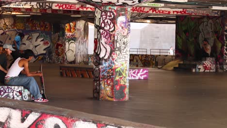 skateboarder executing tricks in urban graffiti park