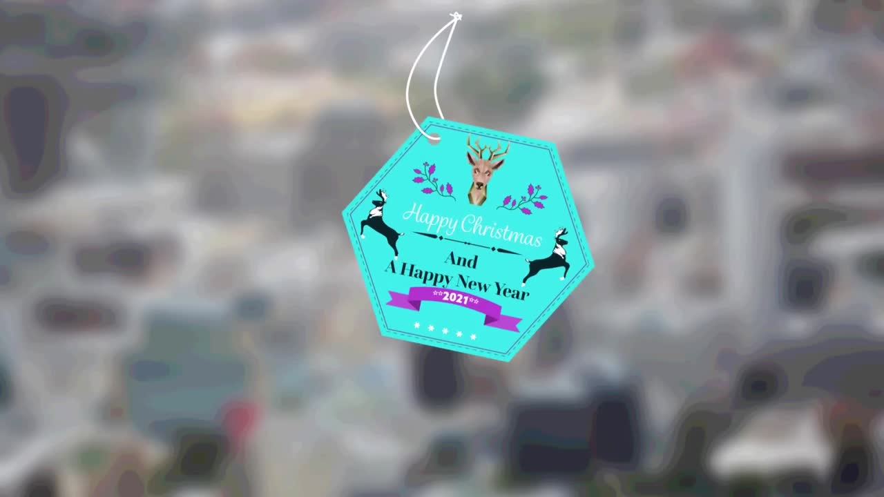 animazione di auguri di natale su tag oltre fuori fuoco paesaggio cittadino sullo sfondo