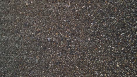 rocky beach at a cloudy day, tilting up into the horizon