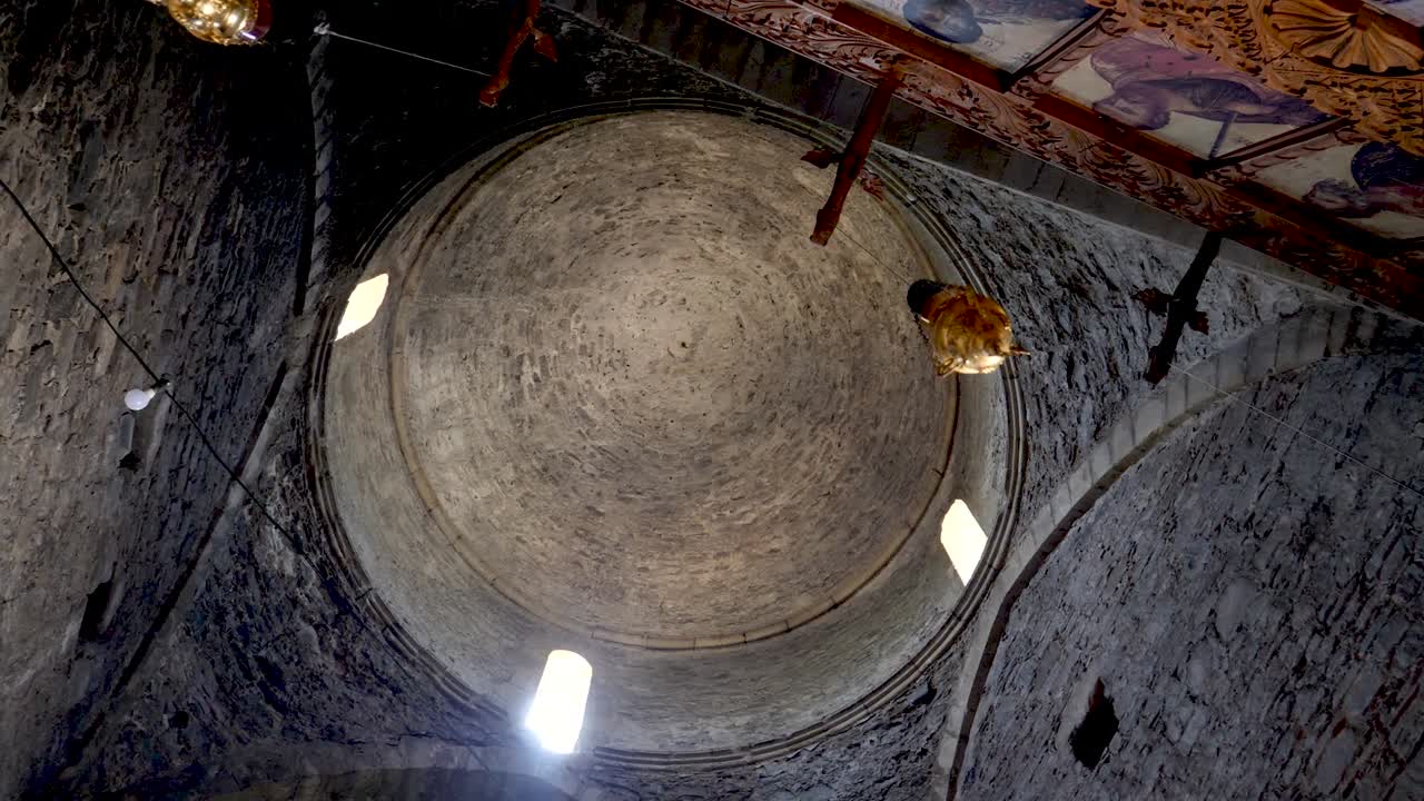 Explore the stunning architecture of an ancient church nestled in Italy, showcasing intricate stonework and beautiful natural light illuminating the interior