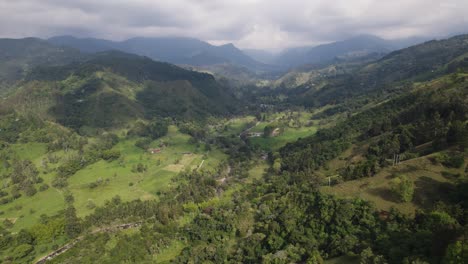 Aerial-over-coffee-growing-area-in-Salento,-Colombia,-green-forest-in-the-andes