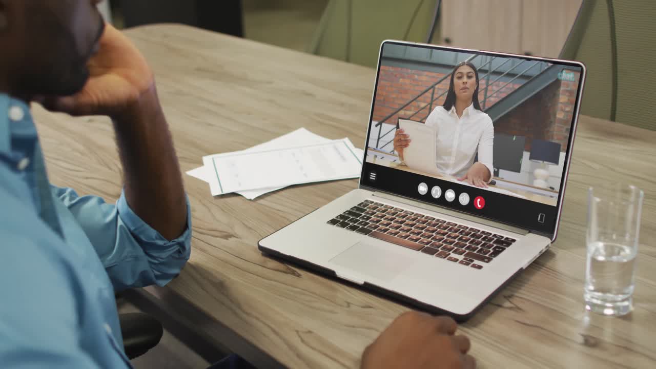 Video of afrcian american man having video call on laptop