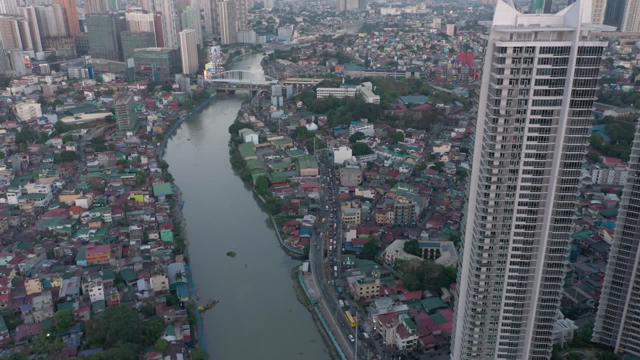 A dynamic aerial view showcases Rockwell Center in Makati during daytime, capturing the modern skyscrapers and vibrant energy of Metro Manila.